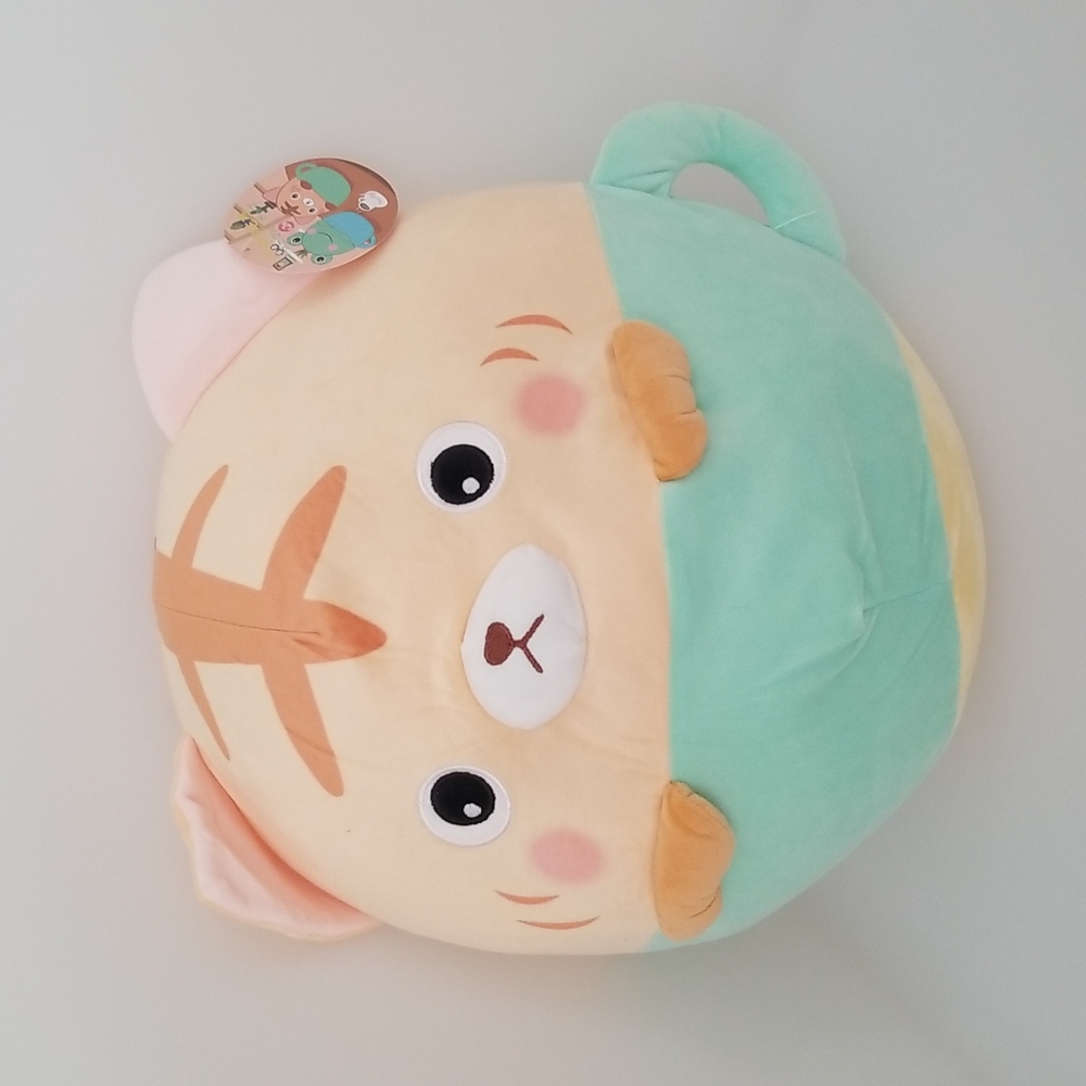 Orange tabby cat in a cup plush